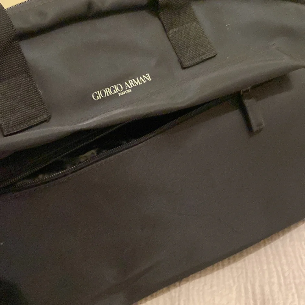 Giorgio Armani Perfums Classic Black Duffel Bag. Unisex model
